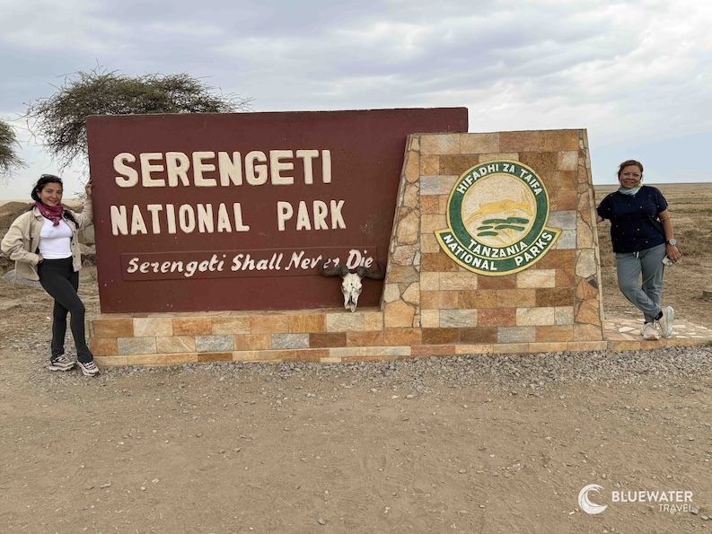 Posing by the Serengeti National Park sign